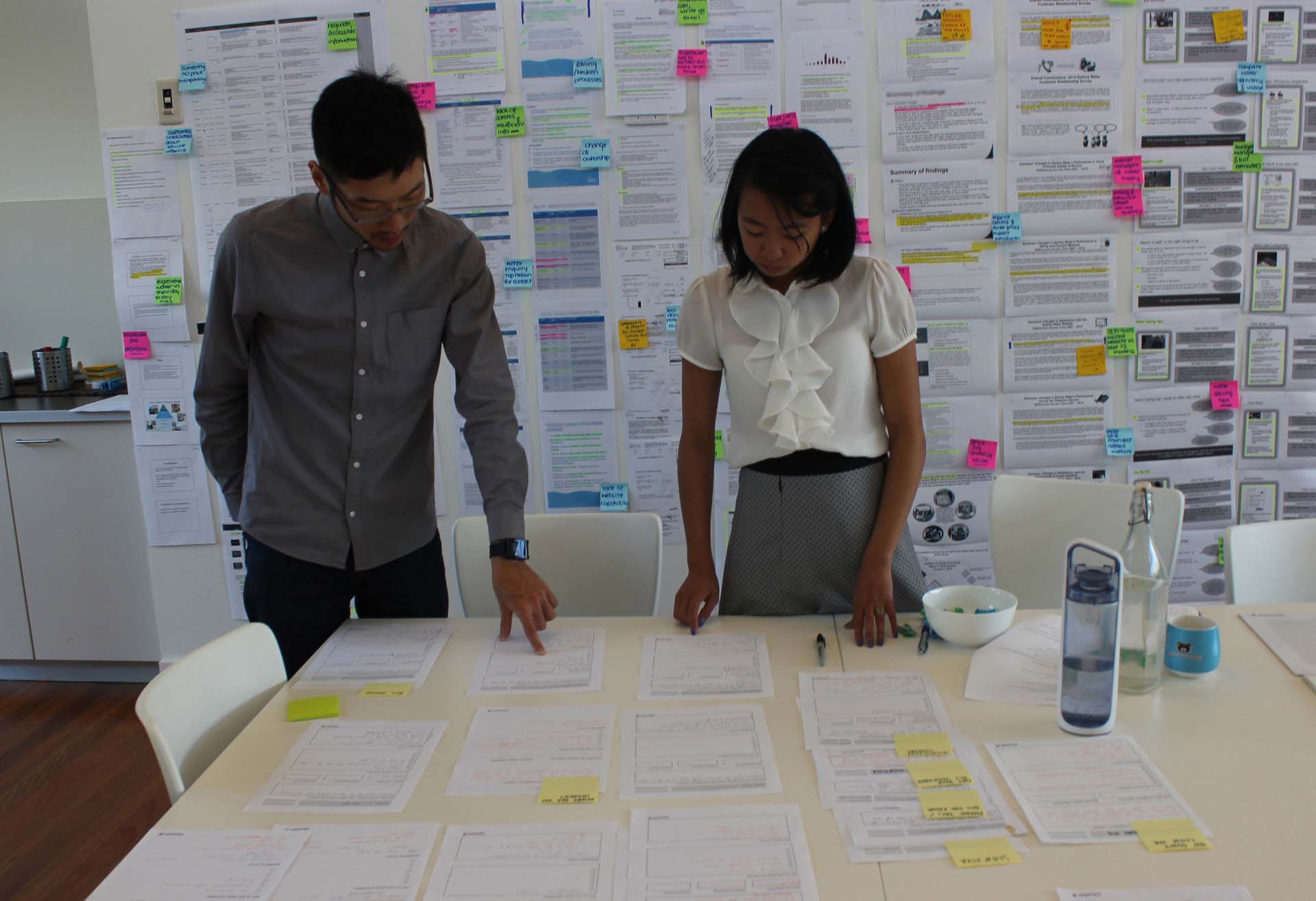 Two proto experience designers analysing research data